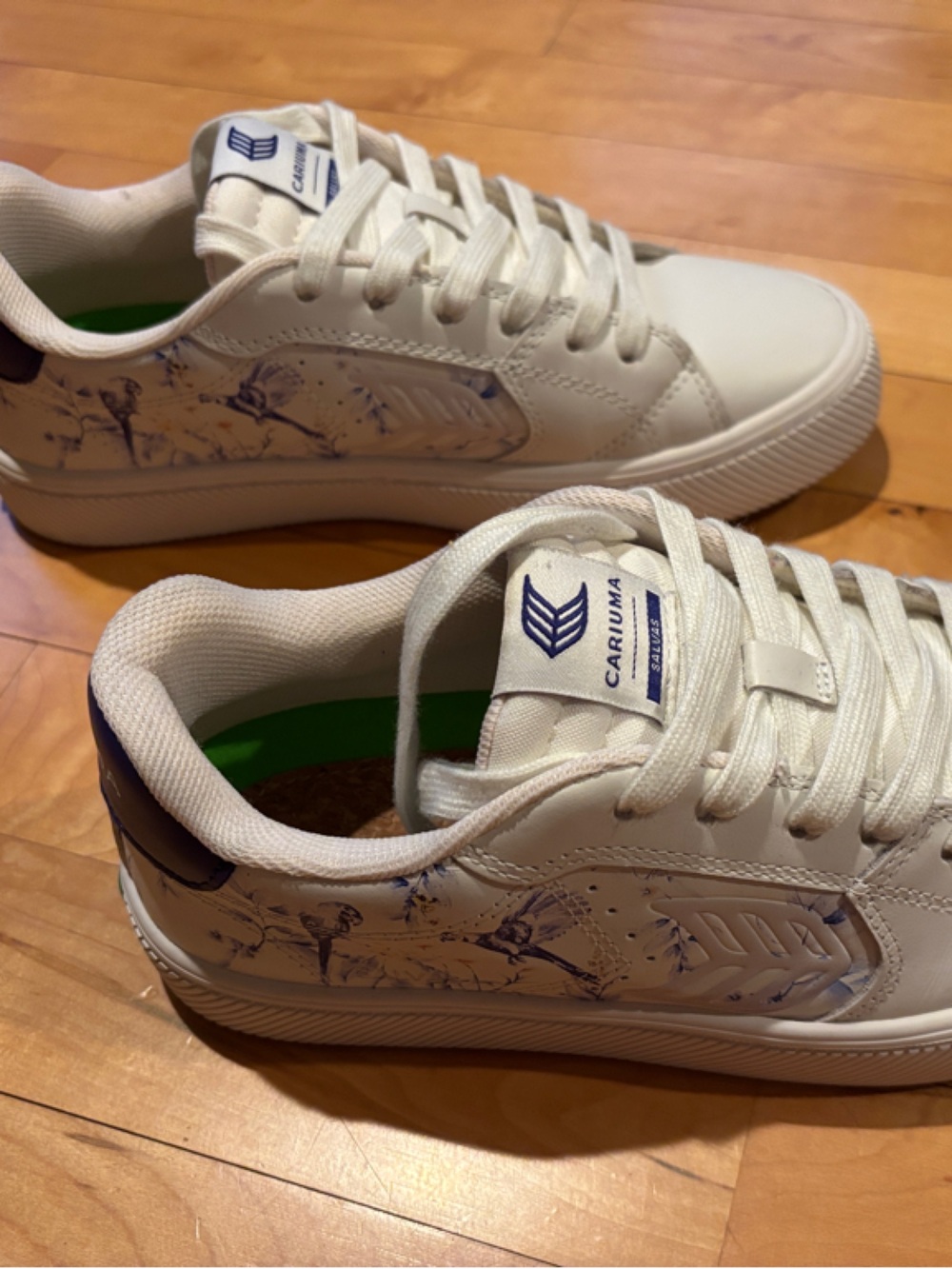 Cariuma White Sneakers with Navy Parrot Accents.  A unique casual look!